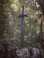 Master Sword Replica in a Mystical Forest Setting. A close up image of a fantasy sword resting on rocks, surrounded by lush foliage. photo