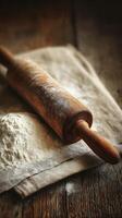 Rustic Wooden Rolling Pin and Flour on Linen Cloth. A close up image of baking ingredients. photo