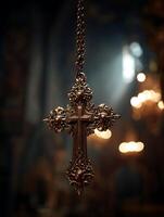 Ornate Religious Cross Hanging in Church Setting. A detailed close up of an intricately designed golden cross. photo