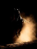 Majestic Silhouette of a Horse Running in Dust, Illuminated by Light. photo