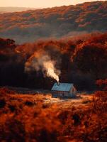 Autumnal Cabin in the Smoky Mountains at Sunrise. A picturesque log cabin nestled amongst vibrant fall foliage, emitting a wisp of smoke from its chimney. photo
