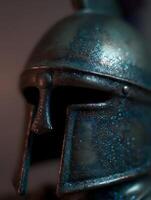 Close Up of a Glittering Ancient Greek Helmet. A detailed image showcasing the texture and metallic sheen of a historical artifact. photo