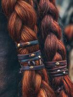Close up of Long Braided Red Hair with Leather and Metal Bands. A detailed image showcasing intricate hair braiding and artisan leatherwork. photo