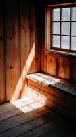Sunlit Wooden Room Interior with Bench and Window. A warm, inviting scene of natural light illuminating a rustic wooden room. photo