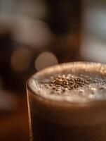 Close Up of a Frothy Beverage Topped with Sesame Seeds. photo