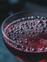 Close Up of Bubbles in a Glass of Red Wine. A detailed image showcasing the texture and effervescence of a red wine. photo