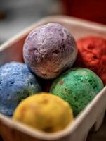 Close Up of Colorful Ice Cream Scoops in a Carton. photo