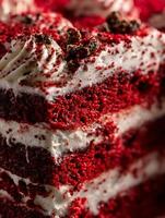 Close Up of Delicious Red Velvet Cake Layers with Cream Cheese Frosting and Chocolate Crumble. photo
