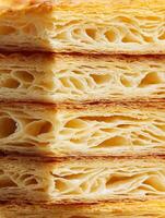 Close Up of Flaky Puff Pastry Layers, Delicious Baked Goods Texture. photo