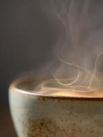 Steam Rising from a Rustic Ceramic Bowl, Close Up. A detailed image showcasing the texture of a handcrafted bowl and the ethereal beauty of rising steam. photo