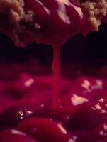 Close up of Crumble Topping with Red Sauce Drizzling Down. photo