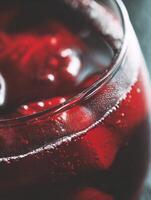 Close up of a Glass of Sparkling Red Liquid. A Detailed Macro Photograph of Bubbles and Reflections. photo