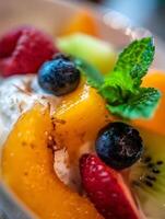 Close Up of Fresh Fruit Salad with Cream and Mint. A vibrant and delicious image perfect for food blogs, magazines, and websites. photo