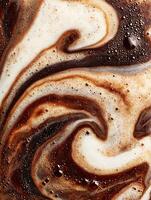 Abstract Swirled Coffee and Cream Texture Close Up of Frothy Beverage. photo
