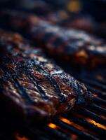Close Up of Grilled Steaks on a Hot Grill. Juicy and charred meat cooking over an open flame. photo