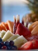 Close Up of Fresh Fruit Platter with Strawberries, Cantaloupe, and Pineapple. photo