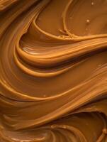 Swirled Caramel Texture Rich Brown Caramel Sauce Background. photo