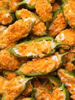 A close up of a plate of buffalo wings photo