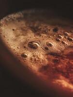 Close Up of Bubbles on Dark Liquid Surface. A detailed macro photograph of the texture and patterns created by bubbles. photo