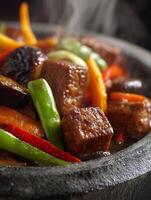Close Up of Steaming Beef and Vegetable Stir Fry in a Stone Bowl. photo