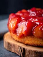 Close up of Delicious Apple Upside Down Cake on Rustic Wooden Board. photo