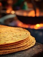 Close up of a Stack of Golden Brown Flatbreads Freshly Cooked on a Hot Griddle. photo