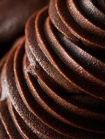 Close Up of Swirled Chocolate Frosting Texture, Rich Brown Dessert Topping. photo