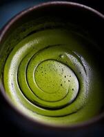 Close up of Swirling Matcha Green Tea in a Bowl. photo