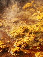 Close Up of Steaming Golden Curry Simmering in a Pan. photo