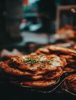 Close up of Delicious Golden Brown Flatbreads Topped with Fresh Herbs. photo