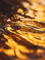 Abstract Golden Liquid Texture Close Up of Swirling Amber Waves. photo