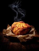 Steaming Hot Roasted Meat on Rustic Wooden Table. A mouthwatering close up of a perfectly roasted meat, still steaming, presented on crumpled brown paper. photo