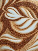 Close Up of Latte Art Swirling Cream and Espresso Texture. photo
