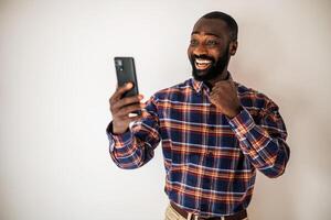 Real, everyday person experiencing a moment of pure joy and satisfaction through a call. photo