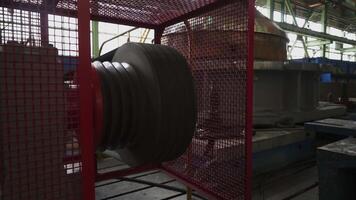 Industrial machine part rotating in factory setting. Stock clip video