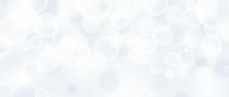 Abstract circle bokeh background. Smooth soft grey blur effect wallpaper. Shiny silver blue blurry sparkles texture. Seasonal backdrop for Christmas, New Year or birthday card, poster, banner.