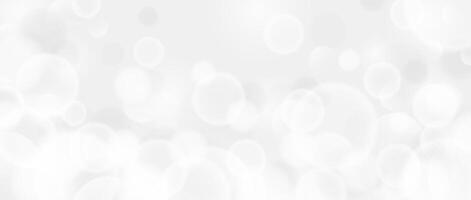 Abstract circle bokeh wallpaper. Smooth soft grey blur effect background. Shiny silver blurry light sparkles texture. Seasonal backdrop for Christmas, New Year or birthday card, poster, banner. vector