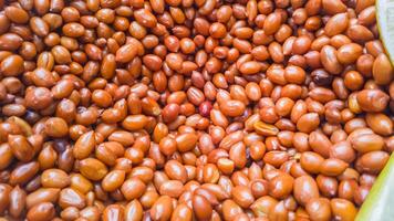 Close-up of a plentiful pile of roasted peanuts photo