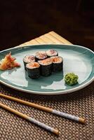 Sushi rolls on a blue plate photo