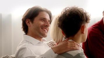 Family members gather in a cozy home, enjoying a joyful Thanksgiving celebration. Laughter and warmth fill the room as they connect and share happy moments together. video