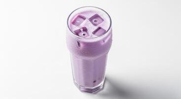A purple smoothie in a glass with a white background photo