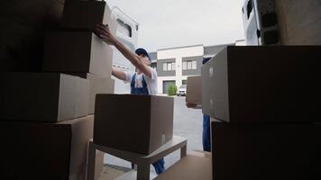 Worker Exiting Vehicle with Box During Residential Move video