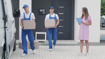 Delivery Workers Handing Over Parcel to Waiting Woman video