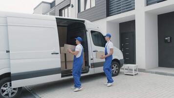 Deliveryman Standing by Open Van During Residential Shipment video