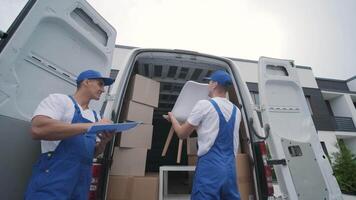Man in Uniform Scanning Parcel with Digital Device video