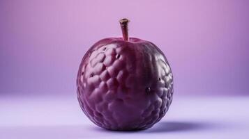 Close-up of a dark, textured plum against a purple background. photo