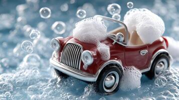 A toy car with soap bubbles on the surface photo