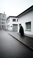 Modern architecture in a quiet urban setting showcases clean lines and minimalist design during an overcast day photo
