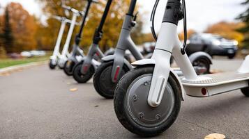 A row of electric scooters lined up on the street photo