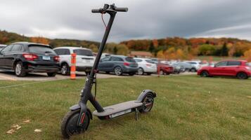 An electric scooter is parked in a field photo